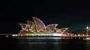 Sydney Opera House merayakan ulang tahunnya yang ke-50 pada hari Jumat, dengan pertunjukan laser yang akan menerangi gedung ikonik ini. (Saeed KHAN / AFP)