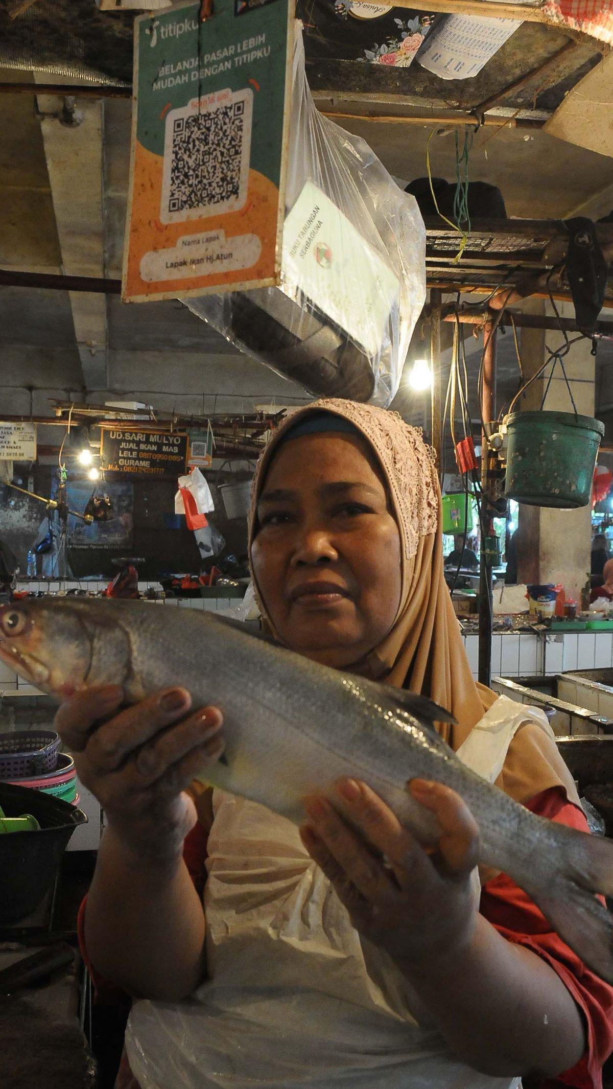 Lantas, siapa diuntungkan dari penetapan tarif layanan QRIS bagi pelaku usaha mikro ini?