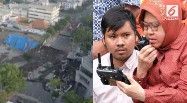 Dengan berkursi roda, Wali Kota Surabaya Tri Rismaharini kembali memantau pengerjaan perbaikan Jalan Raya Gubeng yang ambles gunakan drone.