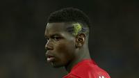 Sebagian suporter Manchester United (MU) masih meragukan kualitas Paul Pogba. (AP Photo/Dave Thompson)
