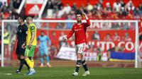Pemain Manchester United Cristiano Ronaldo melakukan selebrasi usai mencetak gol ke gawang Norwich City pada pertandingan sepak bola Liga Inggris di Stadion Old Trafford, Manchester, Inggris 16 April 2022. Manchester United menang 3-2. (AP Photo/Jon Super)