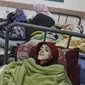 Bocah Palestina berusia 10 tahun, Yazan al-Kafarneh, yang mengungsi dari Beit Hanun dan menderita penyakit bawaan, terbaring di ranjang rumah sakit di Klinik Al-Awda di Rafah. Dia meninggal pada 4 Maret 2024 karena kekurangan gizi parah dan layanan kesehatan yang tidak memadai. (Dok. AFP)