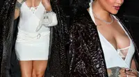 Rihanna mengenakan gaun putih mini dibalut mantel cokelat buaya di pesta makan malam ulang tahunnya yang ke-35. (Dok. Instagram/@favrobz/https://www.instagram.com/p/Co8BsU7Mmm-/)
