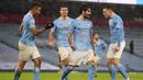 Gelandang Manchester City, Ilkay Gundogan, merayakan gol yang dicetaknya ke gawang Aston Villa pada laga lanjutan Liga Inggris di Etihad Stadium, Kamis (21/1/2021) dini hari WIB. Manchester City menang 2-0 atas Aston Villa. (AFP/Martin Rickett/pool)