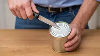 How to open a can without a can opener. (Image: Reve AI)