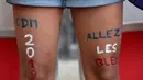 A picture taken on June 12, 2019, at the Nice Stadium in Nice, southeastern France shows the legs of a French supporter ahead of the France 2019 Women's World Cup Group A football match between France and Norway. (Photo by CHRISTOPHE SIMON / AFP)