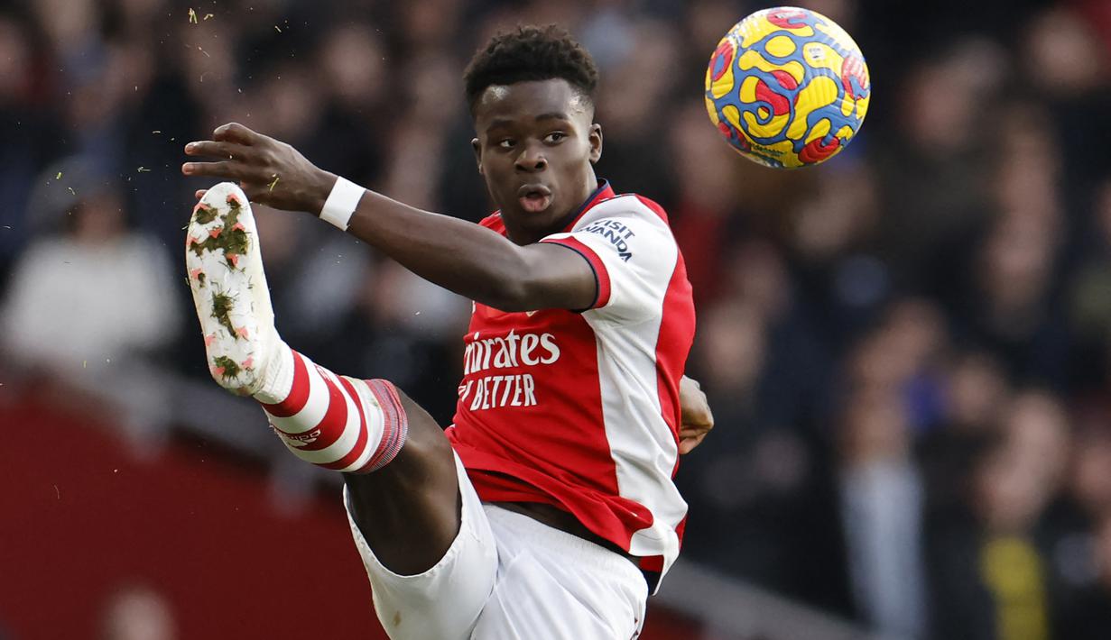 Bukayo Saka. Gelandang 20 tahun yang telah memperkuat Arsenal sejak 2018/2019 ini memiliki nilai pasar 65 juta Euro atau setara Rp.1,07 triliun. Kompetisi tertinggi Eropa yang pernah dicicipinya adalah Liga Europa selama 3 musim berturut-turut, mulai 2018/2019 hingga 2020/2021. (AFP/Tolga Akmen)