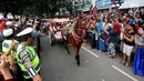 Suasana kirab resepsi pernikahan Kahiyang Ayu-Bobby Nasution di Kota Medan, Sumatera Utara, Minggu (26/11). (Liputan6.com/Johan Tallo)