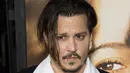 Siapa sangka di balik kerennya Johnny Depp ternyata ia gemar bermain dengan boneka Barbie? (AFP/Bintang.com)