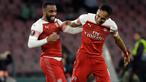 Penyerang Arsenal, Alexandre Lacazette (kiri) berselebrasi bersama rekannya Pierre-Emerick Aubameyang usai mencetak gol ke gawang Napoli pada leg kedua babak perempat final Liga Europa di stadion San Paolo di Naples, Italia (18/4). Arsenal menang tipis 1-0 atas Napoli. (AP Photo/Luca Bruno)