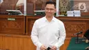 Ekspresi terdakwa kasus dugaan perintangan penyidikan pada kasus pembunuhan Brigadir Yosua, Irfan Widyanto usai menjalani sidang putusan di Pengadilan Negeri Jakarta Selatan, Jumat (24/2/2023). Vonis ini lebih ringan dari tuntutan jaksa penuntut umum (JPU) terhadap peraih Adhi Makayasa itu. Sebelumnya, JPU menuntut hukuman selama satu tahun penjara. (Liputan6.com/Herman Zakharia)