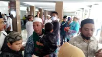 Kedatangan Jamaah Haji Banyuwangi Disambut Haru Keluarganya (Hermawan Arifianto/Liputan6.com)