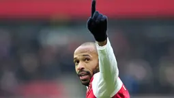 Thierry Henry bermain untuk Arsenal pada 1999 hingga 2007. Henry saat ini menjadi asisten pelatih untuk Timnas Belgia. (AFP/Glyn Kirk)