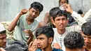 Para imigran Rohingya tersebut mendarat pada Selasa malam sekitar pukul 23.00 WIB. (CHAIDEER MAHYUDDIN / AFP)