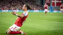 Pemain depan Denmark, Yussuf Poulsen berselebrasi usai mencetak gol ke gawang Israel pada pertandingan kualifikasi Grup F Piala Dunia FIFA Qatar 2022 di Kopenhagen (7/9/2021). Kemenangan ini membawa Denmark duduk di puncak klasemen dengan 18 poin. (Mads Claus Rasmussen/Ritzau Scanpix/AFP)