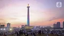 Suasana acara Munajat dan Maulid Akbar 2019 #ReuniMujahid212 di kawasan Monas, Jakarta, Senin (2/12/2019). Aksi dimulai dengan salat tahajud bersama pada pukul 03.00 WIB dan ditutup dengan doa yang berakhir pada pukul 08.00 WIB. (Liputan6.com/Herman Zakharia)