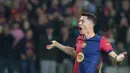 Pada menit ke-66, Robert Lewandowski mencetak gol keduanya di laga ini. (LLUIS GENE/AFP)