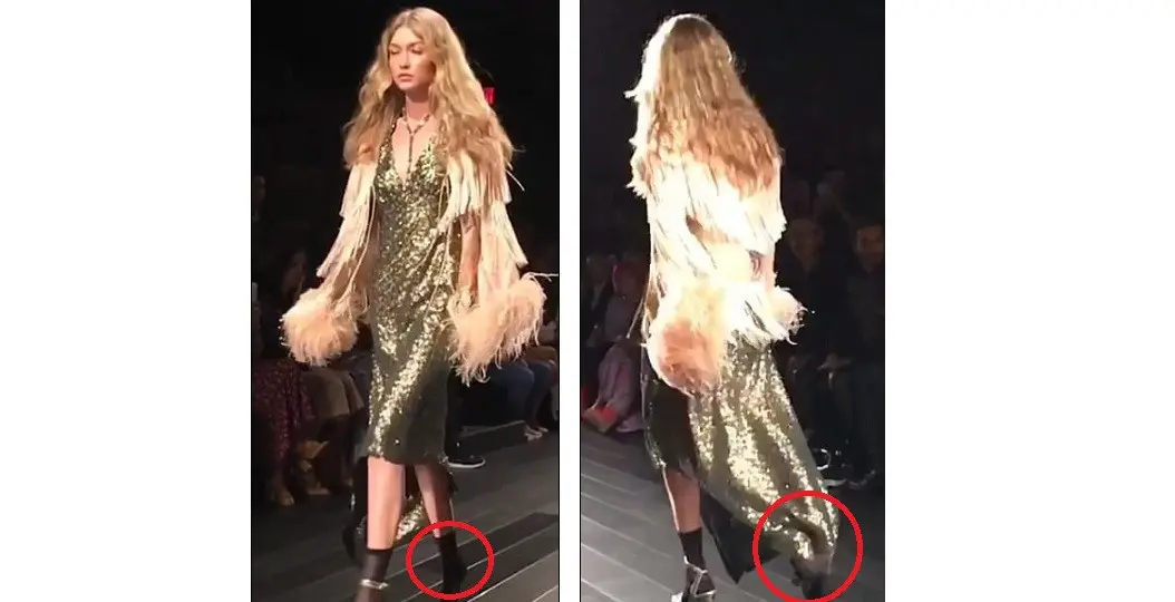 Gigi Hadid yang melepaskan salah satu sepatunya di catwalk (Dialymail)