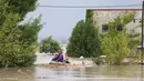 Hujan badai dahsyat melanda Yunani, Turki, dan Bulgaria, memicu banjir yang menyebabkan beberapa orang meninggal dunia. (AP Photo/Vaggelis Kousioras)