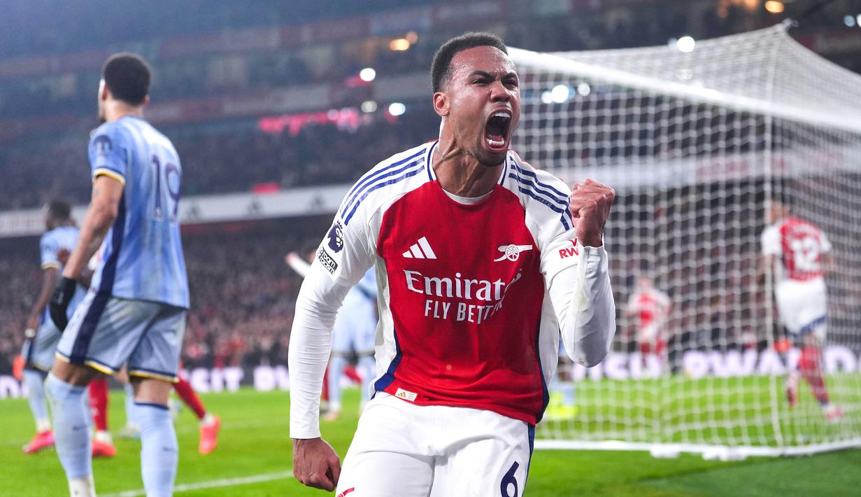 Arsenal sukses mengalahkan Tottenham dengan comeback apik 2-1 dalam laga pekan 21 Premier League 2024/2025 yang digelar di Emirates Stadium, Kamis (16/1/2025) dini hari WIB. (Bradley Collyer/PA via AP)