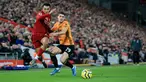 Bek sayap Liverpool, Trent Alexander-Arnold berebut bola dengan pemain Wolvehampton Wanderers, Ruben Vinagre dalam pekan ke-20 Liga Inggris 2019-2020 di Anfield, Minggu (29/12/2019). Liverpool semakin perkasa di Premier League setelah menang 1-0 atas Wolverhampton. (AP/Jon Super)