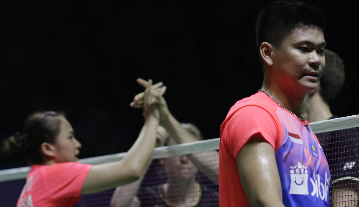 Pasangan Indonesia, Praveen Jordan/Melati Oktavianti, saat bertanding melawan wakil Jerman, Mark Lamsfuss/Isabel Herttrich pada Indonesia Open 2019 di Istora, Jakarta, Selasa (16/7). Pasangan Indonesia takluk 20-22, 14-17. (Bola.com/M Iqbal Ichsan)