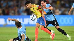 Uruguay berhasil mengalahkan Kolombia dengan skor 3-2. (DANTE FERNANDEZ/AFP)