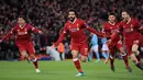 Penyerang Liverpool Mohamed Salah merayakan gol bersama rekan setimnya saat melawan Manchester City dalam pertandingan Liga Champions di Anfield, Liverpool (4/4). Liverpool menang 3-0 atas Manchester City. (Peter Byrne/PA via AP)