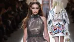 Supermodel Gigi Hadid mengenakan koleksi busana karya rumah mode Fendi Spring/Summer 2017 pada ajang peragaan busana wanita Milan Fashion Week 2017 di Milan, Italia, (21/9). Gigi Hadid tampak seksi dengan busana transparan. (AFP Photo/Giuseppe Cacace)