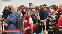 Suasana hari pertama pemberlakuan travel bubble  antara Australia dan Selandia Baru di Bandara Internasional Sydney, Senin, 19 April 2021. (dok.SAEED KHAN / AFP)