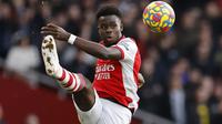 Bukayo Saka. Gelandang 20 tahun yang telah memperkuat Arsenal sejak 2018/2019 ini memiliki nilai pasar 65 juta Euro atau setara Rp.1,07 triliun. Kompetisi tertinggi Eropa yang pernah dicicipinya adalah Liga Europa selama 3 musim berturut-turut, mulai 2018/2019 hingga 2020/2021. (AFP/Tolga Akmen)