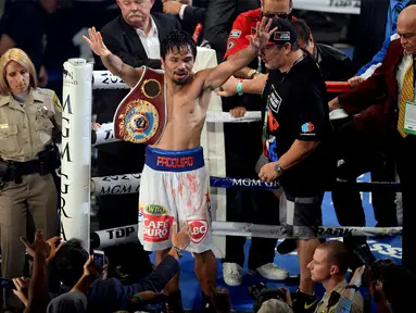Petinju Filipina, Manny Pacquiao, sukses merebut kembali gelar juara dunia kelas Walter WBO, setelah dinyatakan menang mutlak atas rivalnya Timothy Bradley, Sabtu waktu setempat atau Minggu (13/4/2014). (REUTERS/Joe Camporeale-USA TODAY)