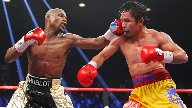 Floyd Mayweather Berhasil Taklukan Manny Pacquiao