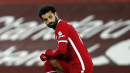 1. Mohamed Salah (Liverpool) - Posisi pemain asal Mesir ini belum tergoyahkan dari urutan puncak daftar top skor sementara Liga Inggris 2020/2021. Mohamed Salah sendiri telah mencetak 13 gol dari 17 laga Liverpool musim ini. (AFP/Clive Brunskill/pool)