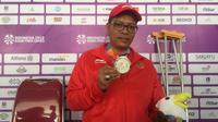 Pecatur putra Indonesia, Maksum Firdaus, berhasil meraih dua medali perak di Asian Para Games 2018. (Bola.com/Benediktus Gerando Pradigdo)