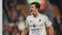 Pemain Manchester United, Harry Maguire, berteriak semangat setelah timnya berhasil mengalahkan Liverpool di Anfield dalam lanjutan Liga Inggris 2025/2026, Minggu (19/10/2025) malam WIB.