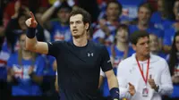 Petenis Inggris Raya, Andy Murray, merayakan kemenangan atas wakil Belgia, Ruben Bemelmans, pada partai final Piala Davis di landers Expo, Ghent, Belgia, Sabtu (28/11/2015) dini hari WIB. (Reuters / Jason Cairnduff)