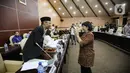 Deputi Gubernur Senior Bank Indonesia (BI) Destry Damayanti bersiap mengikuti rapat kerja dengan DPD RI di Kompleks Parlemen, Senayan, Jakarta, Rabu (14/6/2023). (Liputan6.com/Faizal Fanani)