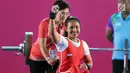 Atlet Para Powerlifting Indonesia, Ni Nengah Widiasih usai melakukan angkatan pada Asian Para Games 2018 di Jakarta, Minggu (7/10). Ni Nengah berhasil menyumbang perak perdana untuk Indonesia di Asian Para Games 2018. (Liputan6.com/Helmi Fithriansyah)