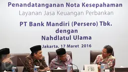 Bank Mandiri akan memberikan produk dan jasa keuangan warga NU termasuk kartu anggota NU (KartaNU). Dengan kartu itu, warga NU dapat melakukan berbagai transaksi keuangan dengan lebih mudah dan cepat, Jakarta, Kamis (17/3). (Liputan6.com/Angga Yuniar)