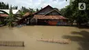 Banjir merendam rumah warga di Desa Sindangsari, Kabupaten Bekasi, Jawa Barat, Rabu (24/2/2021). Sebagian rumah warga masih terendam banjir yang disebabkan jebolnya tanggul Sungai Citarum dan luapan Sungai Ciherang. (merdeka.com/Imam Buhori)