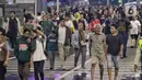 Sepanjang jalan Jenderal Sudirman hingga MH Thamrin dipadati warga yang ingin menghabiskan malam terakhir di tahun 2023. (Liputan6.com/Angga Yuniar)