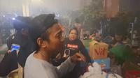 Ruslan (42), pedagang kelontong di&nbsp;Pasar Taman Puring, Kebayoran Baru, Jakarta Selatan,&nbsp;Senin malam (28/7/2025). (Liputan6.com/Nanda Perdana Putra)