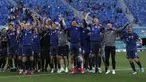 Para pemain Slovakia melakukan selebrasi usai pertandingan grup E Euro 2020 melawan Polandia di stadion Saint Petersburg di St. Petersburg, Rusia, Senin (14/6/2021). Slovakia menang tipis atas Polandia 2-1. (Evgenya Novozhenina/Pool via AP)