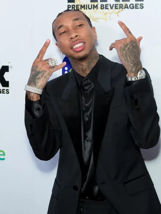 Setelah beberapa bulan putus dengan Tyga dan kemudian pacaran dengan Travis Scott, Kylie Jenner membawa kabar baru bahwa dirinya sedang berbadan dua. Di awal kehamilan Kylie, Tyga pun buka suara. (AFP/Greg Doherty)