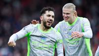 Pemain Manchester City, Rayan Cherki, bersama Erling Haaland merayakan gol ke gawang Nottingham Forest pada laga pekan ke-18 Premier League di Stadion The City Ground, Sabtu (27/12/2025). (Barrington Coombs/PA via AP)