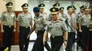 Kapolri Jenderal Tito Karnavian bersiap memimpin upacara kenaikan pangkat perwira tinggi Polri di Rupatama Mabes Polri, Jumat (21/7). Enam polisi berpangkat brigjen mendapat kenaikan pangkat menjadi Inspektur Jenderal (Irjen). (Liputan6.com/Faizal Fanani)