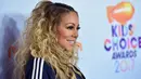 Mariah Carey tumbuh besar di Long Island. Keluarganya benar-benar kesulitan secara finansial setelah bercerai. (Mike Windle  GETTY IMAGES NORTH AMERICA  AFP)