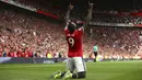 Pemain Manchester United, Romelu Lukaku merayakan gol pertamnya saat melawan West Ham pada laga perdana Premier League di Old Trafford,  Manchester (13/8/2017). MU menang 4-0. (AP/Dave Thompson)