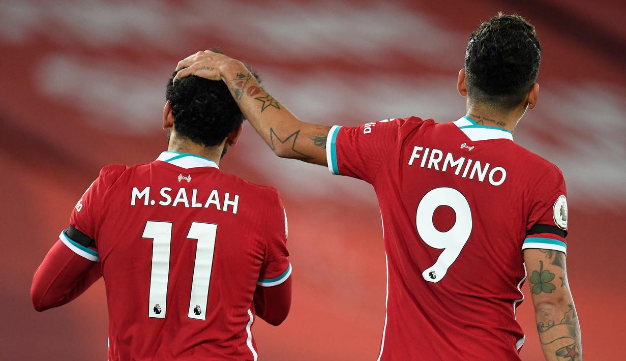 Roberto Firmino. Gelandang serang Liverpool ini mengenakan nomor punggung 11 di awal kedatangannya pada 2015/2016 hingga 2016/2017. Usai kedatangan Mohamed Salah pada 2017/2018 ia memberikan nomor tersebut kepada Salah dan mengganti nomornya menjadi 9 hingga kini. (Foto: AFP/Pool/Peter Powell)